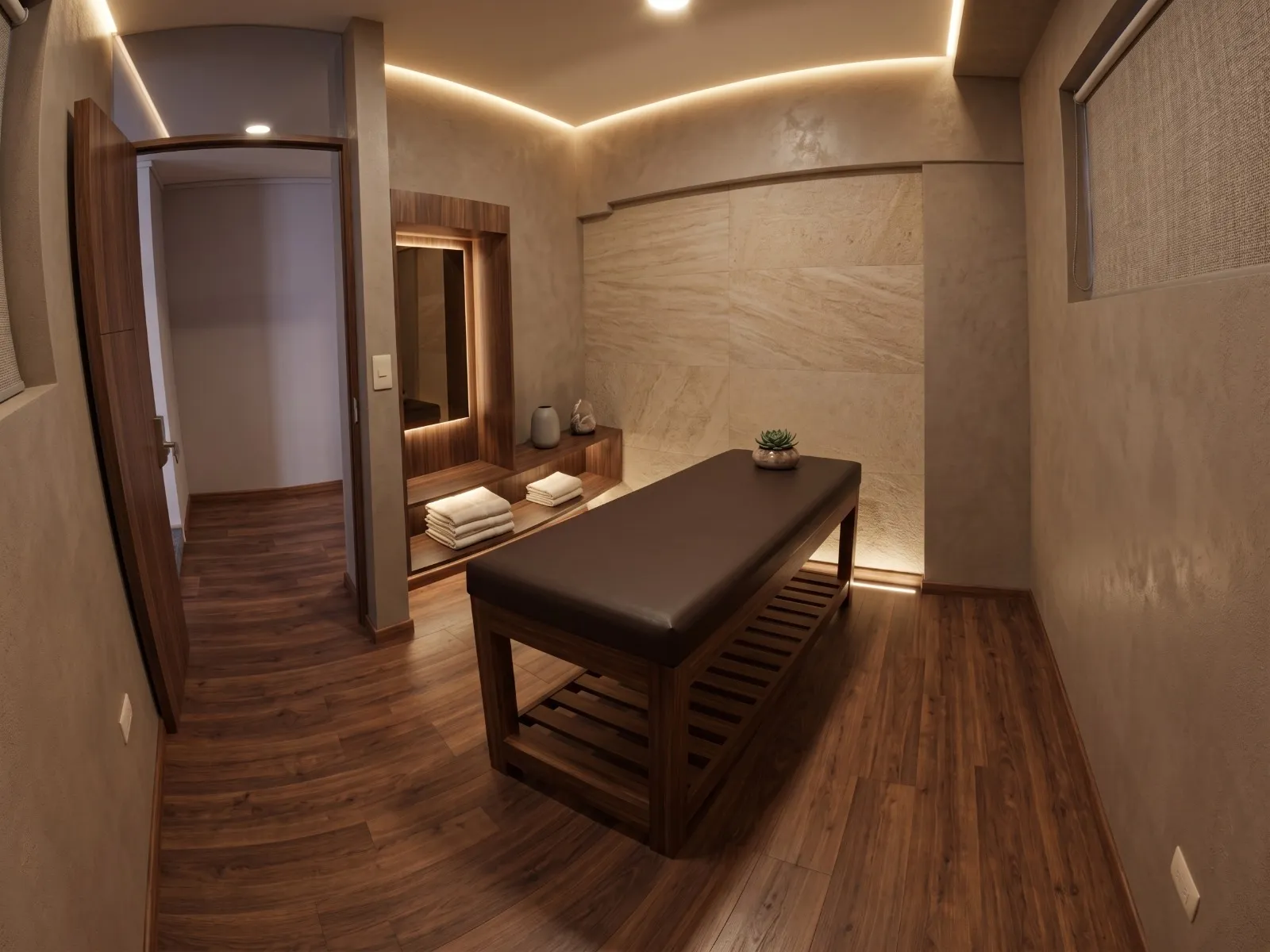 Single massage room with a wooden massage table and an illuminated stone wall, at Spa Cusco inLove